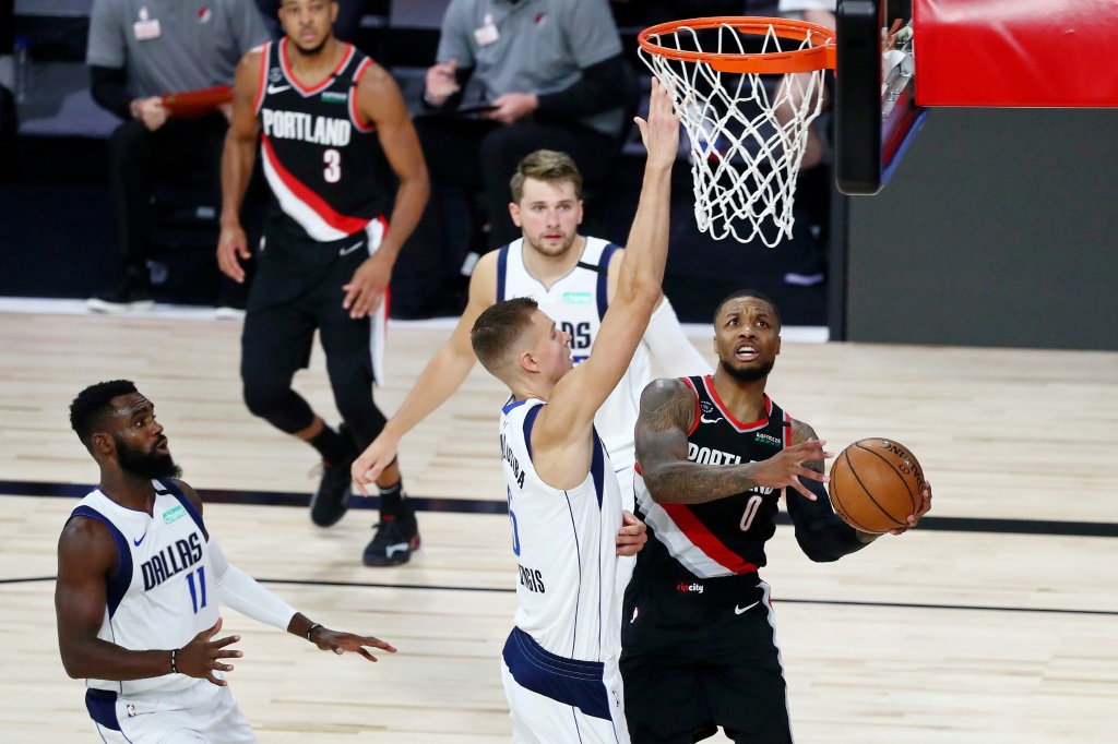 Damian Lillard's third 60-point game of the season has put Portland on the brink of a place in the playoffs