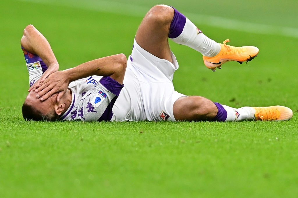 Fiorentina's French forward Franck Ribery reacts in pain after being tackled during the Italian Serie A football match Inter vs Fiorentina on September 26