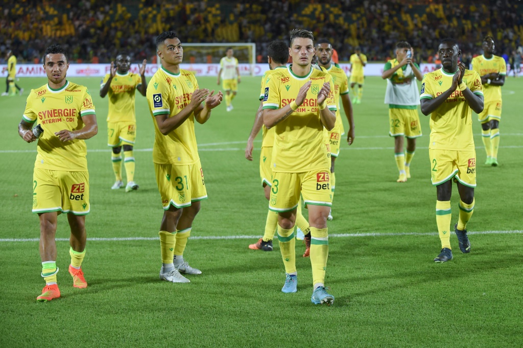 Nantes' players react at the end of the French L1 football match between FC Nantes and LOSC Lille at the Stade de la Beaujoire–Louis Fonteneau in Nantes, western France on August 12, 2022.